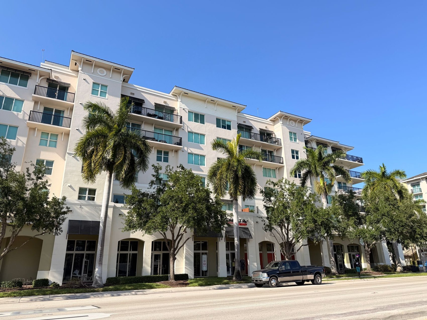 A Florida-style apartment community with palm trees